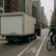 Chicago truck dooring accident lawyer article showing a delivery truck near a bicycle lane