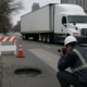 Chicago truck accident caused by a road hazard near a pothole and lane transition