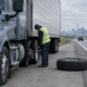 Commercial truck with a failed tire on a Chicago highway, illustrating a Chicago truck tire blowout accident