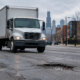 Chicago truck accident road defect liability scene with a truck near uneven pavement